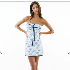 With Jéan Sabrin Toile Papillon dress.